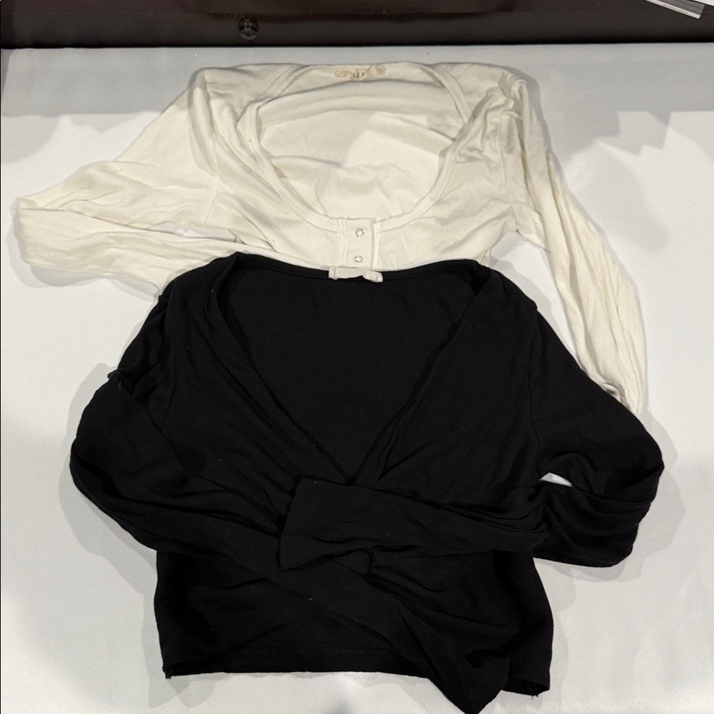 TWO ILLA ILLA Black and white tops. Both size small.